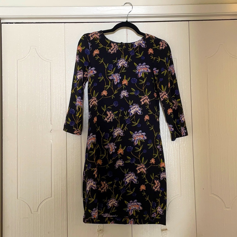 Long sleeve black floral dress.